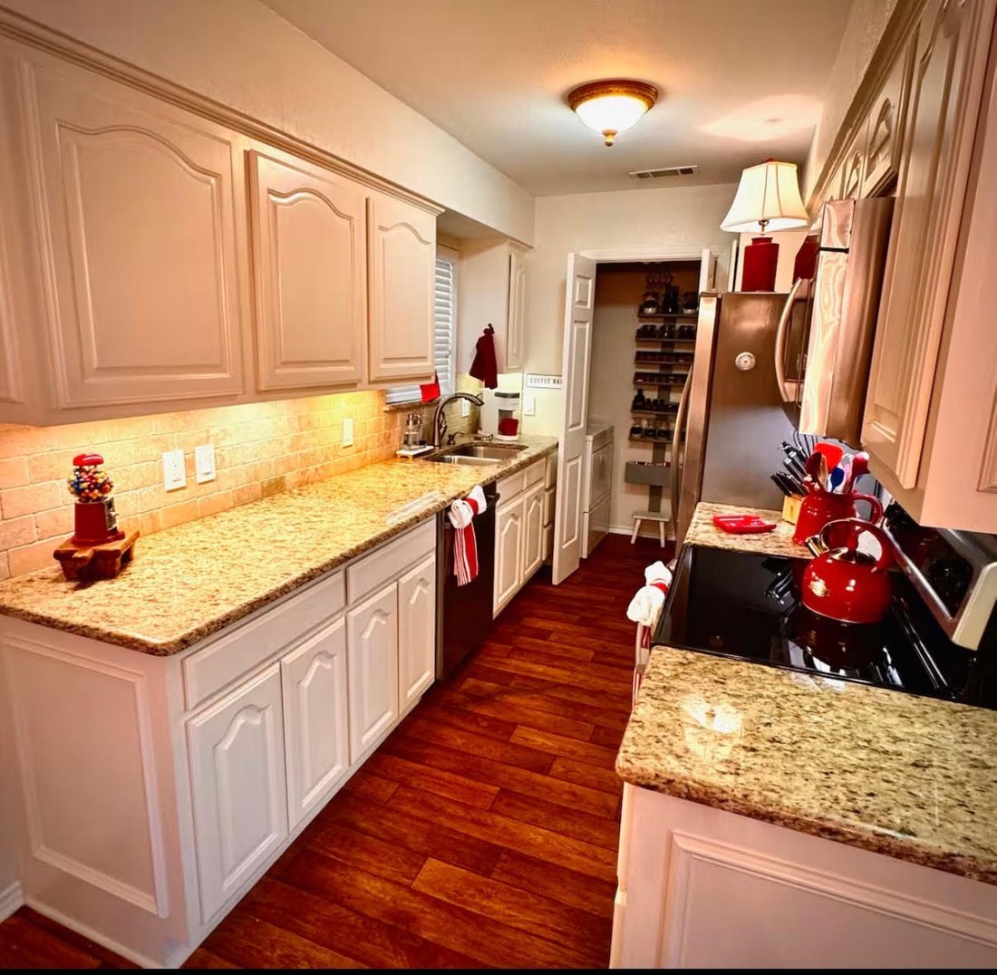 The galley kitchen at The Rustic Chandelier, with granite counters and a coffee bar